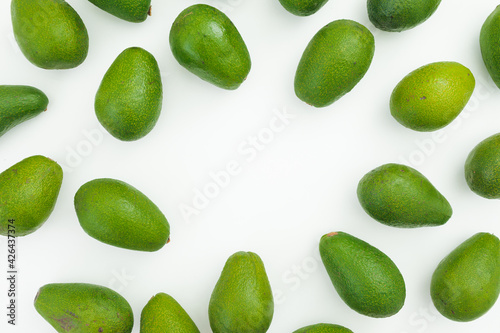 Avocado frame on white background. Flat lay, top view. Food concept.