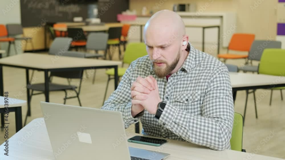 Teacher who teaches online lessons sits in front of the computer. Teacher who teaches online lessons sits in front of the computer.