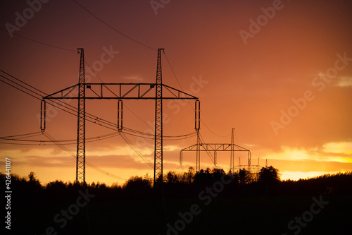 high power line at orange sunset