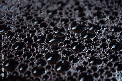 Black drop of water. Abstract background