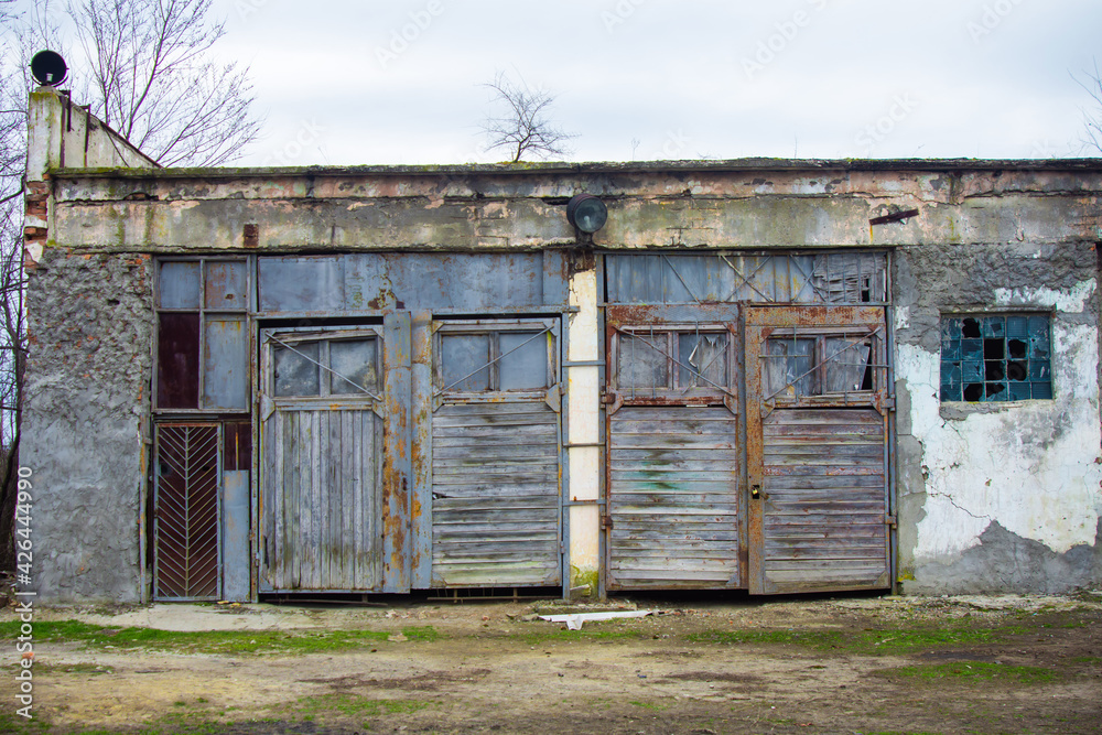 Very old garage door for storing farm equipment. Very old garage door for storing farm equipment.