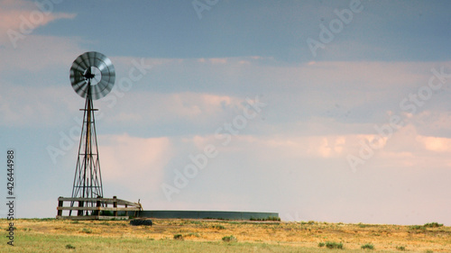 Windmill at sunset, Weld County, Colorado photo