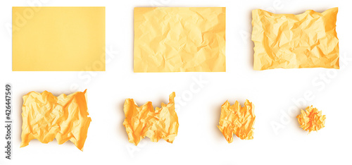 Set of yellow creased paper. Smooth sheet of paper crumpled into ball step by step. Isolated on white background with soft shadows