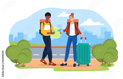 Male and female tourists are looking for a place on the map