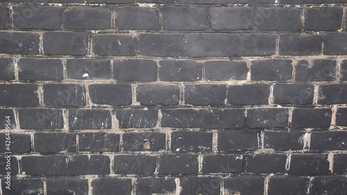 Принти на полотні Background with black smoked soot brick wall.