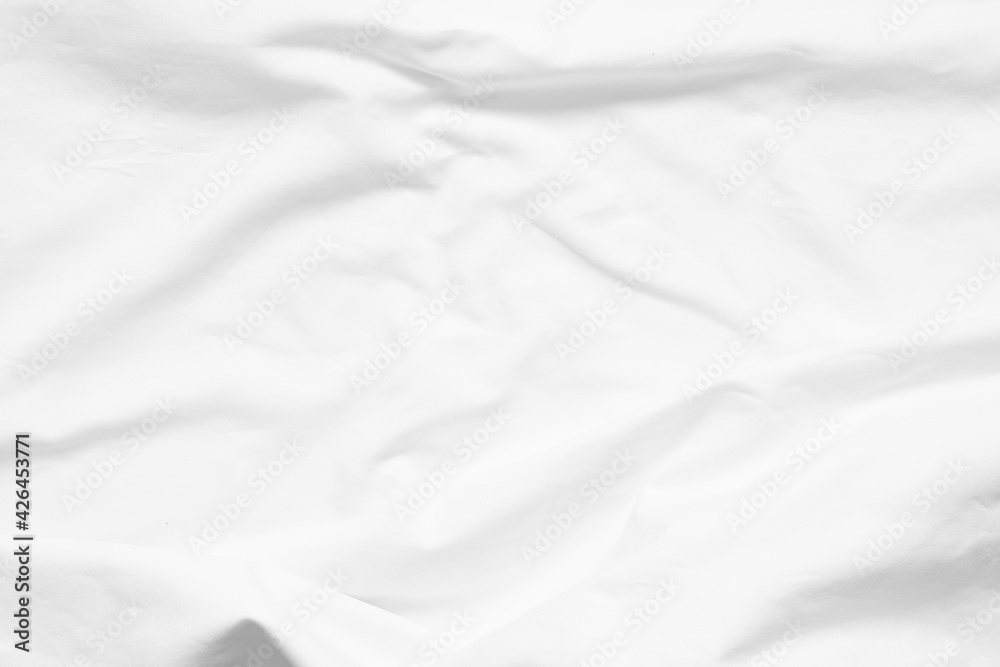 crease of blank white bedsheet for background.
