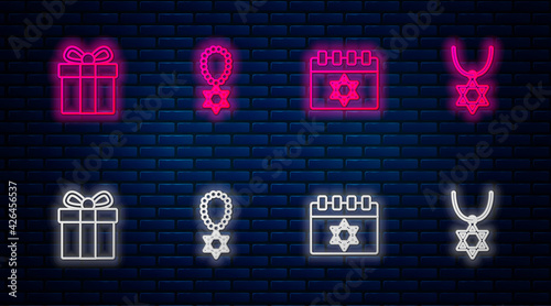 Set line Star of David necklace on chain, Jewish calendar, Gift box and . Glowing neon icon on brick wall. Vector