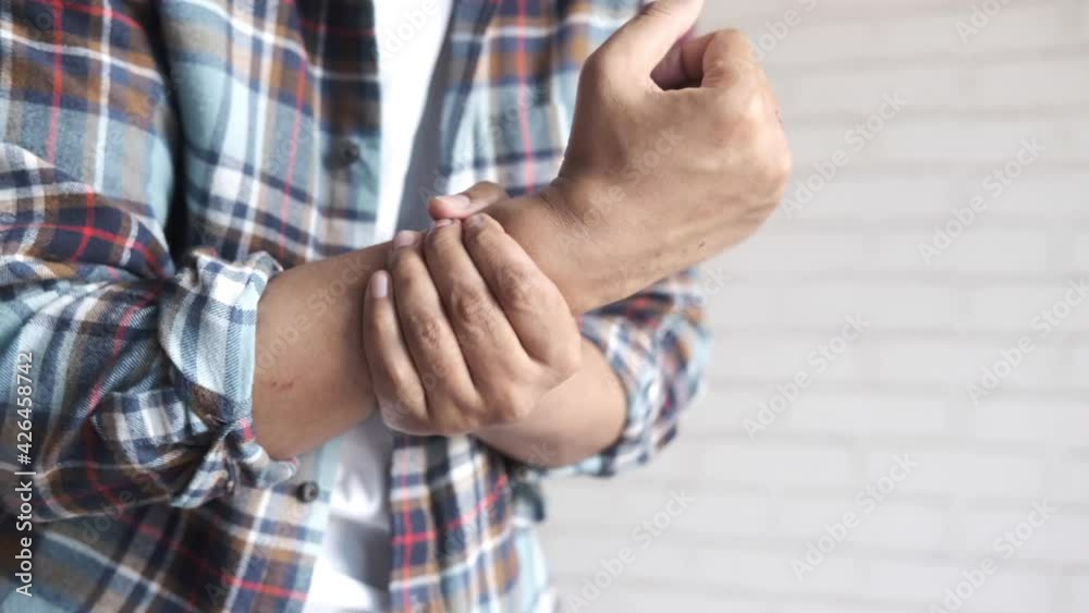 man suffering pain in hand close up man suffering pain in hand close up