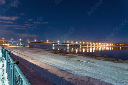 The embankment in Perm in winter, the Kama River in the evening twilight.