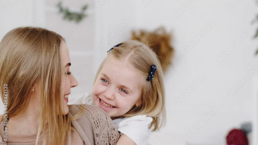 Female portrait, cute preschooler girl little daughter child baby closes eyes to mother beloved mum parent plays hide and seek with mommy game at home weekends, woman talking with kid smiling laughing Female portrait, cute preschooler girl little daughter child baby closes eyes to mother beloved mum parent plays hide and seek with mommy game at home weekends, woman talking with kid smiling laughing