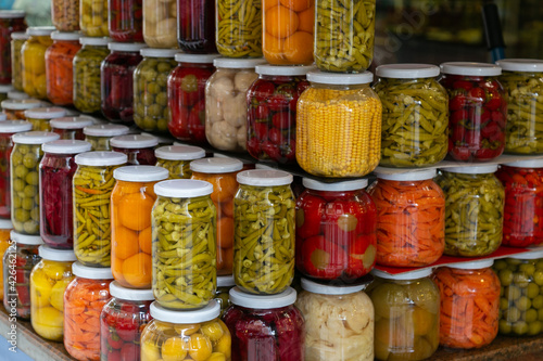 Billede på lærred Various preserved pickled vegetables in glass jars
