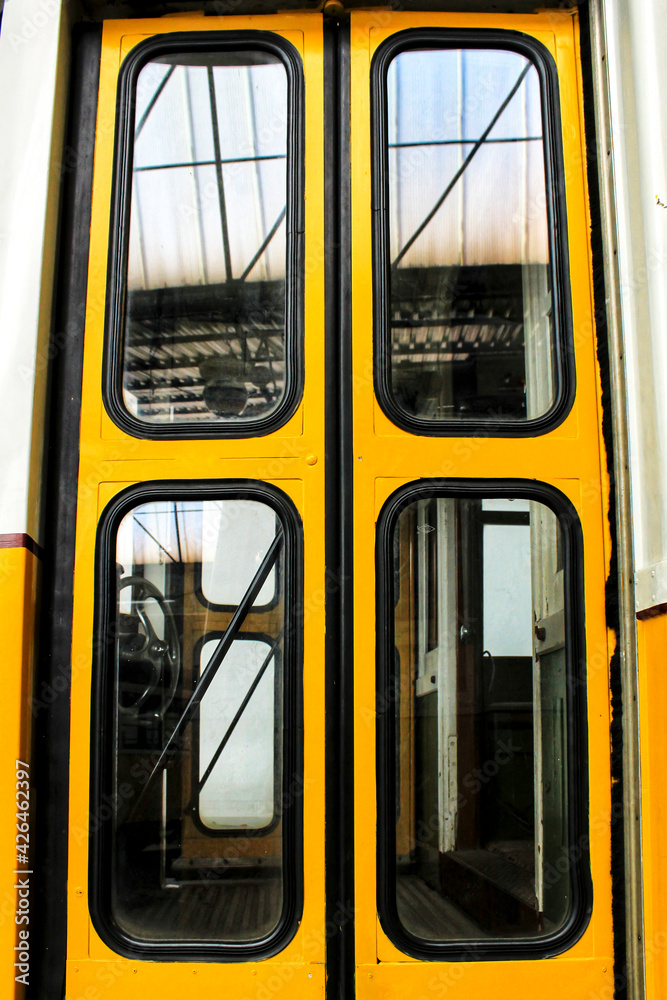 Old yellow passenger bus door