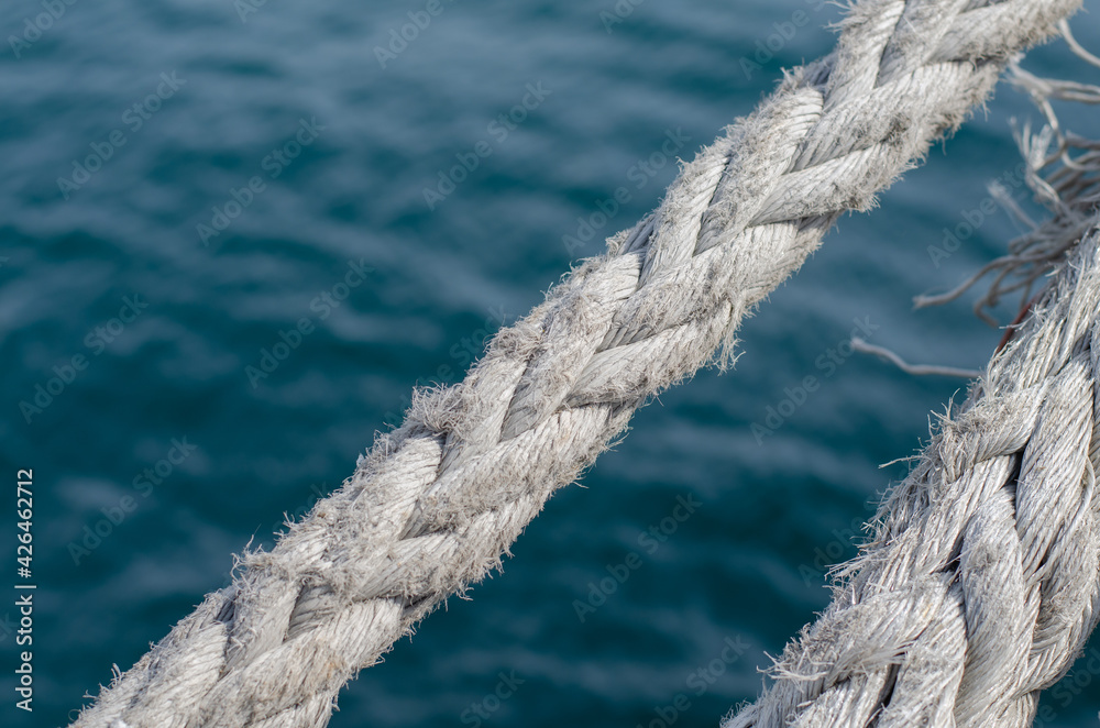 Marine rope. Moored ship. Synthetic fiber. Rope knot. Sisal rope. Marine rope. Moored ship. Synthetic fiber. Rope knot. Sisal rope.