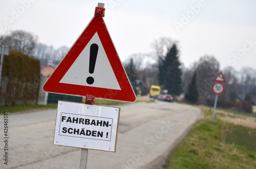 Fahrbahnschäden und Frostaufbrüche auf einer Straße in Österreich, Europa - Road damage and frost breakouts on a street in Austria, Europe photo