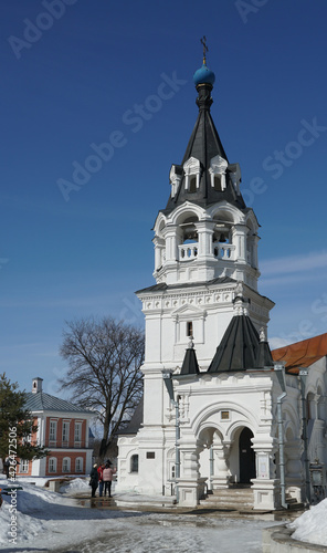 Bell tower and entrance to the Orthodox church. Early spring, the city of Murom.