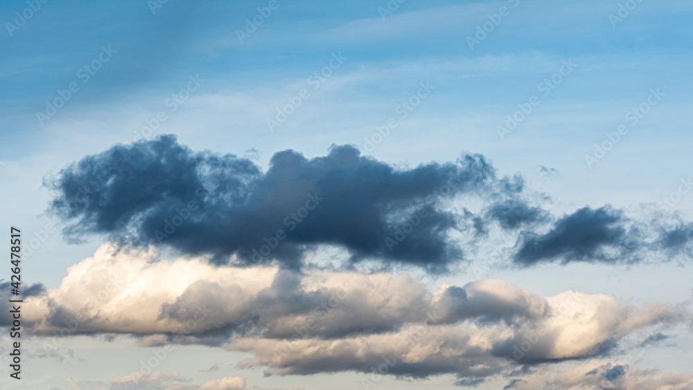 Blue sky and rainy clouds. Nature background