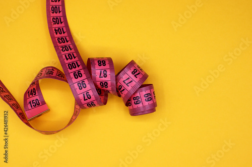 tape measure on a colorful background