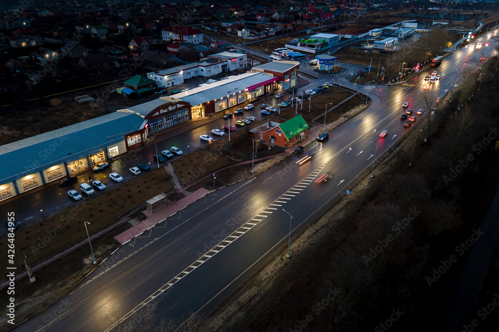 The car light trails in the city street Traffic. Top Down Aerial Drone view of a road at night