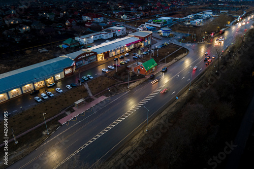 The car light trails in the city street Traffic. Top Down Aerial Drone view of a road at night