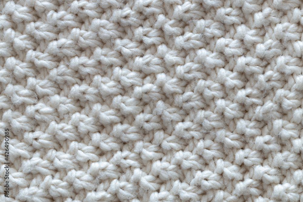 Background from beautiful, knitted background, nodules pattern. Concept handicrafts, DIY, leisure, fashionable warm clothes, hobbies. Top view, macro, close-up, flat lay. Horizontal Background from beautiful, knitted background, nodules pattern. Concept handicrafts, DIY, leisure, fashionable warm clothes, hobbies. Top view, macro, close-up, flat lay. Horizontal