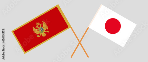 Crossed flags of Montenegro and Japan. Official colors. Correct proportion