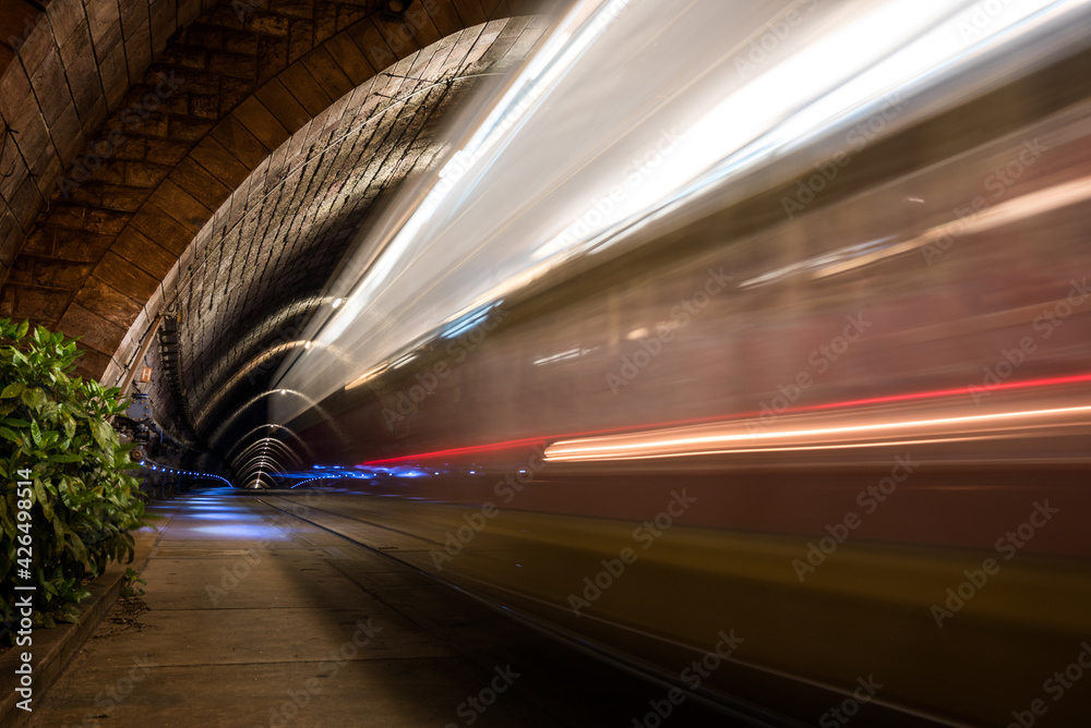 Illuminated Tramway Tunnel with Tram Light Trails at Night in Bratislava, Slovakia