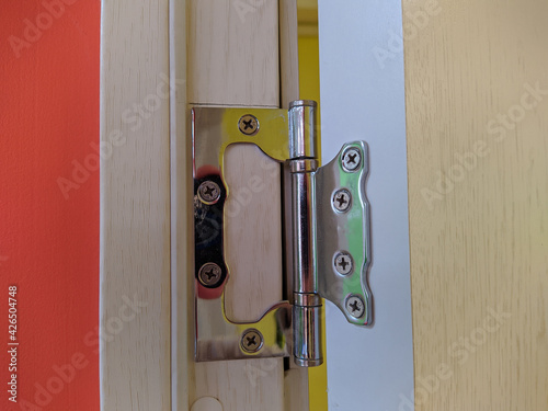 stainless door hinges on wooden swing door