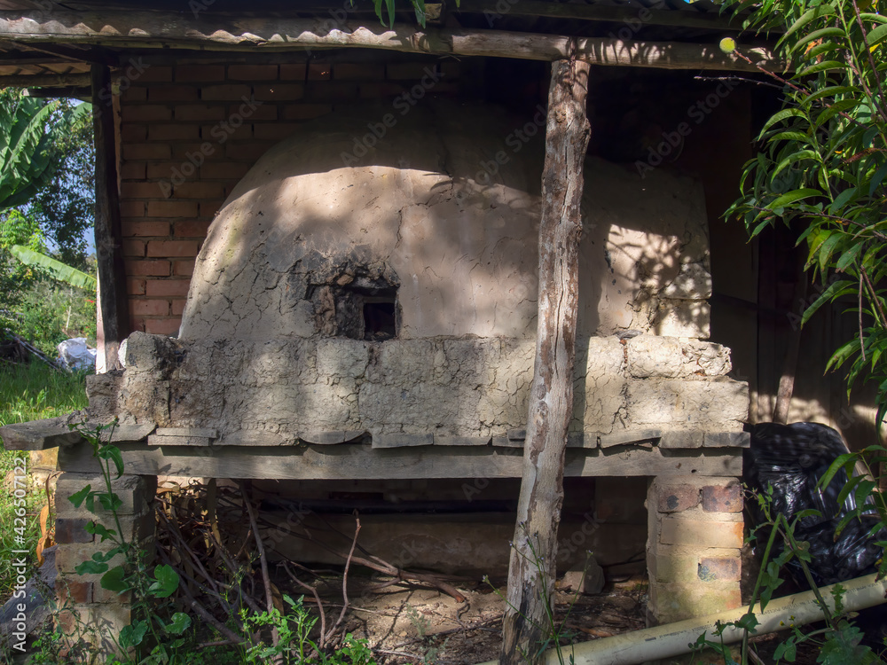 A traditional rustic homemade bricks oven, attached to an old rural house in a farm near the town of Arcabuco, in the central Andean mountains of Colombia.