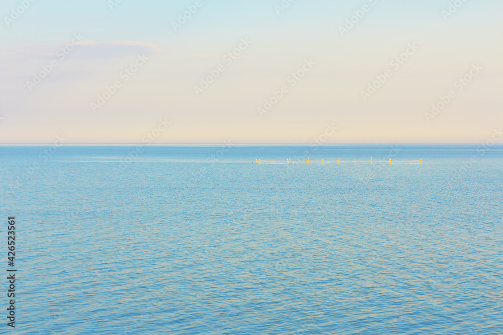 Obraz premium Calm sea in the morning with fishing net 