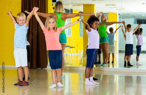 Smiling children dancing contemp in studio smiling and having fun. High quality photo