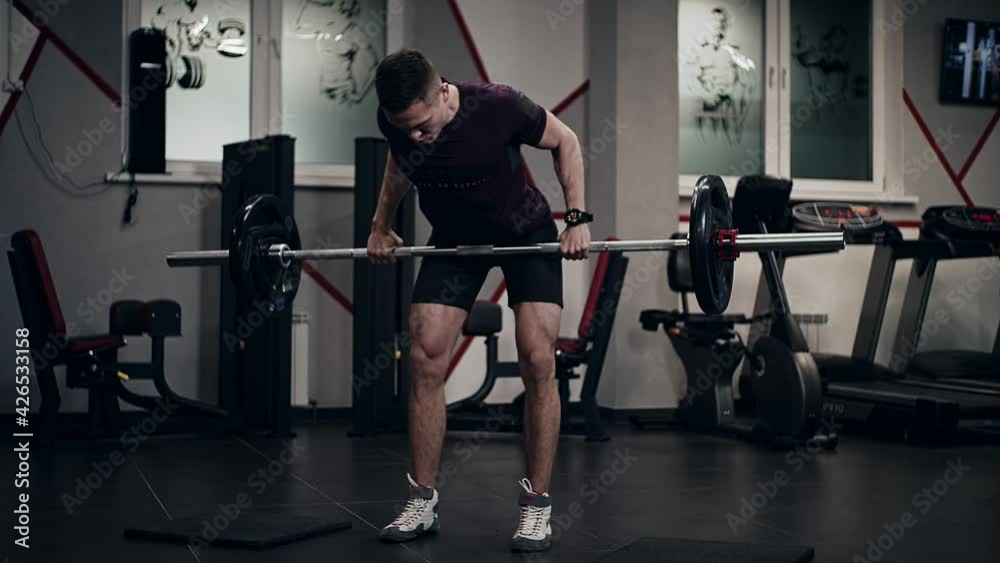 Gym train of handsome guy. Slow motion