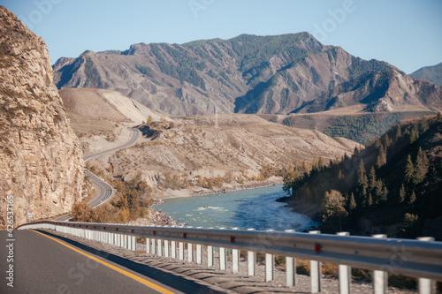 Wallpaper Mural Road Chuya tract in Altai Mountains with river on the side, Siberia, Russia. Torontodigital.ca