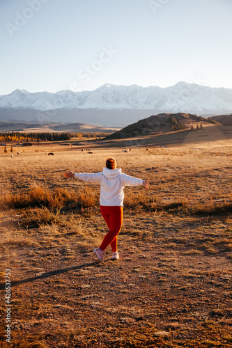 Wallpaper Mural Happy young woman in Kurrai steppe in Altai Republic in early autumn Torontodigital.ca
