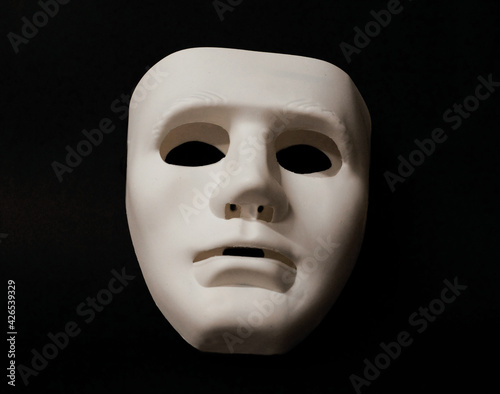 Theatrical mask set at an angle to give the viewer an impression of eye movement.