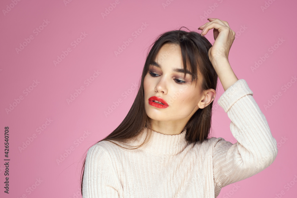 Beautiful brunette red lips white blouse close-up attractive view pink background Beautiful brunette red lips white blouse close-up attractive view pink background