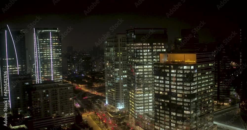 Aerial view of skyscrapers, on the Berrini Avenue, night in Sao Paulo city - Tracking, drone shot Aerial view of skyscrapers, on the Berrini Avenue, night in Sao Paulo city - Tracking, drone shot