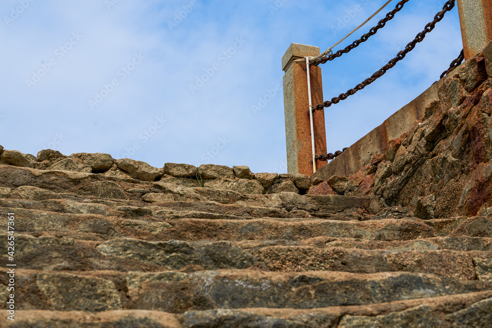 Abandoned pier stone stairs and rusty guardrails by the sea Abandoned pier stone stairs and rusty guardrails by the sea