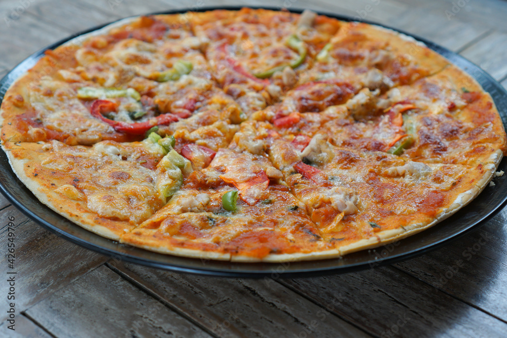 Delicious chicken pizza that is still warm Delicious chicken pizza that is still warm