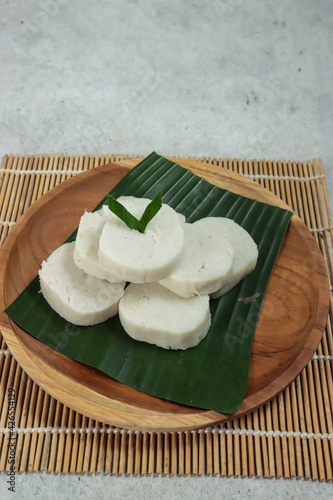 Jadah or gemblong ketan, is a traditional dessert from Indonesia, made from mashed sticky rice and grated coconut. photo