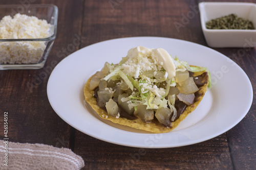 Traditional Mexican food.Beef leg toast with cream, lettuce and cheese.