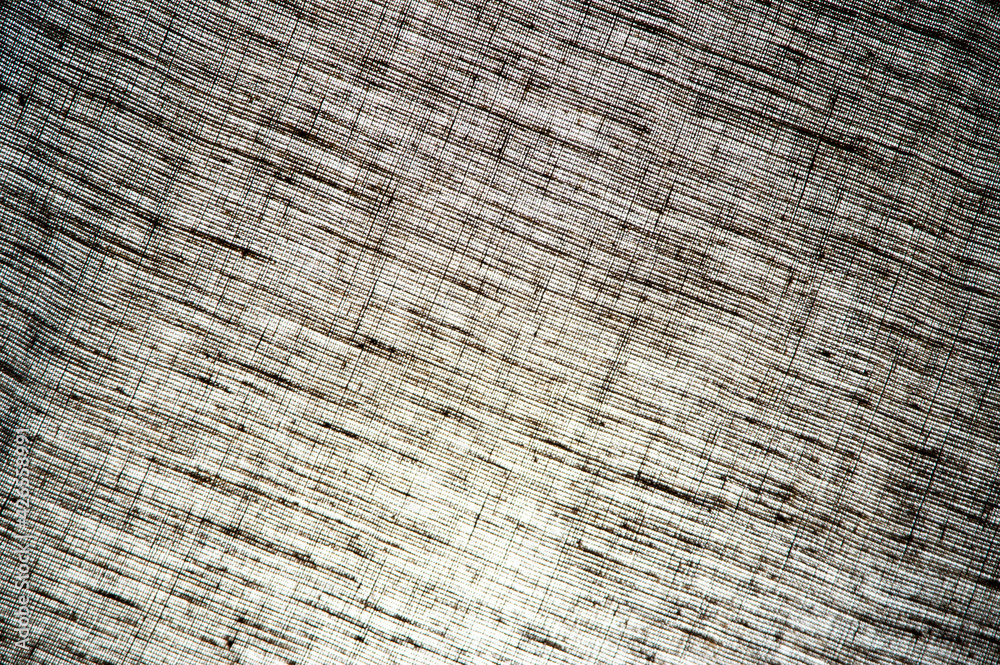 Fototapeta premium abstract rough light linen natural fabric background, short focus