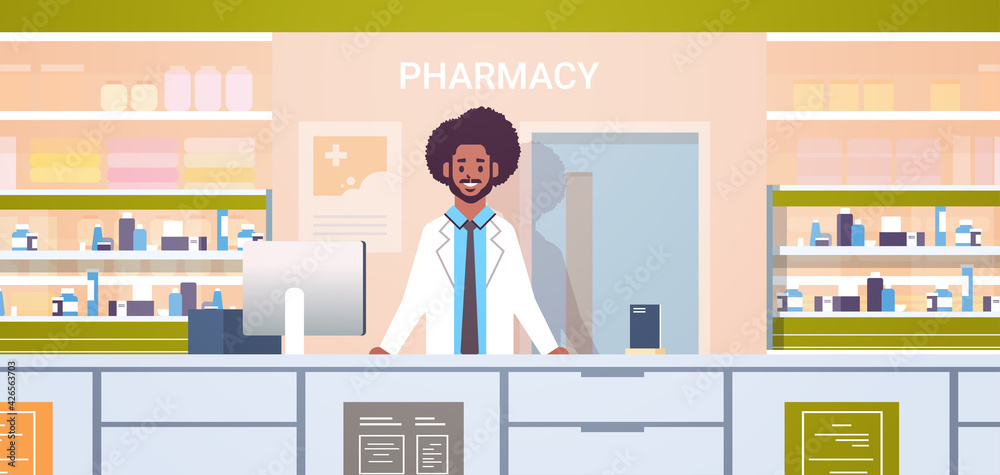 african american male doctor pharmacist standing at pharmacy counter modern drugstore interior medicine healthcare concept horizontal portrait african american male doctor pharmacist standing at pharmacy counter modern drugstore interior medicine healthcare concept horizontal portrait