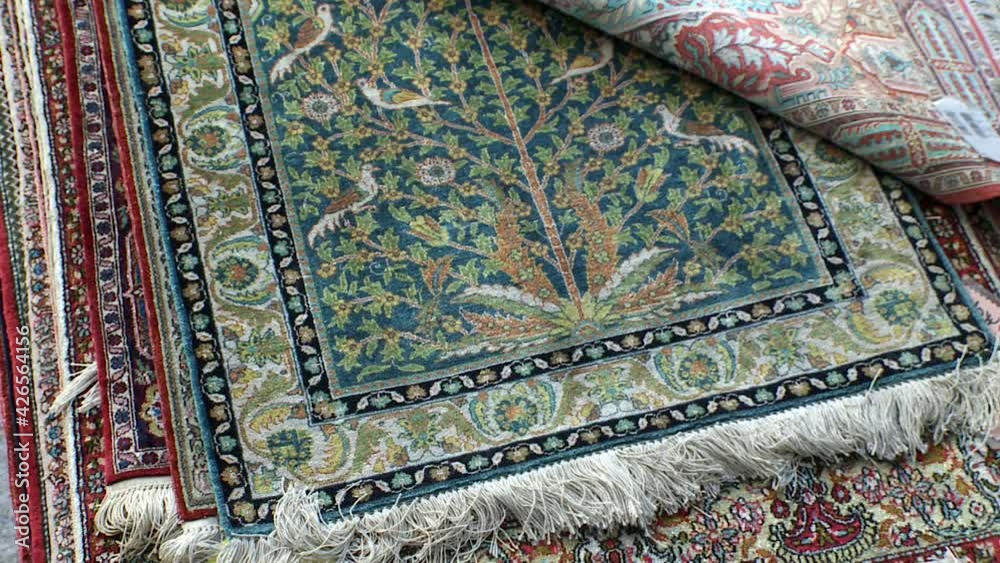 picking up old Persian carpets picking up old Persian carpets