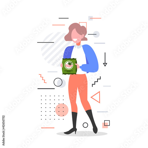 smiling woman holding cannabis product box marijuana legalization drugs consumption concept full length