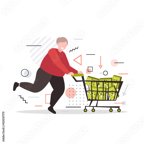 smiling man pushing trolley cart with medical cannabis products in boxes marijuana legalization drugs consumption concept full length