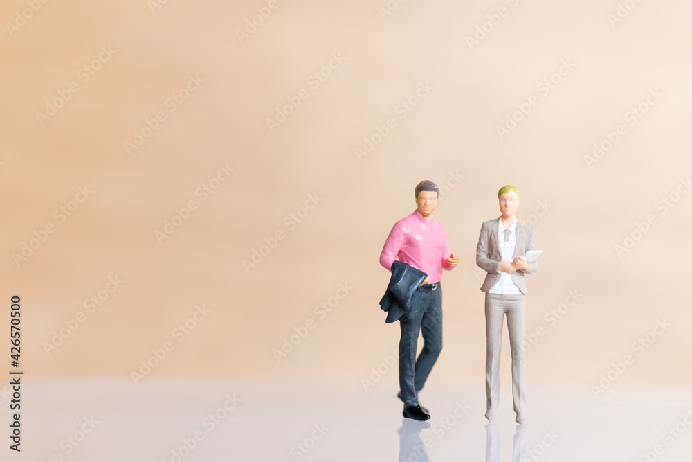 Miniature Business people standing and copy space for text Miniature Business people standing and copy space for text