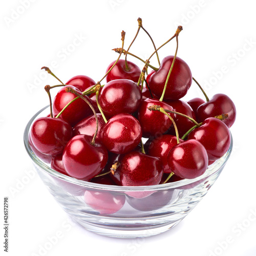 glass bowl of sweet cherry fruits isolated on white background