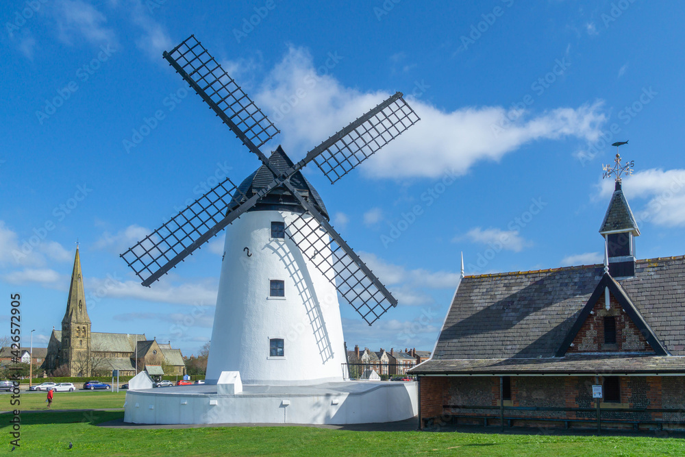 White windmill and church in the town of Lytham in Lancashire