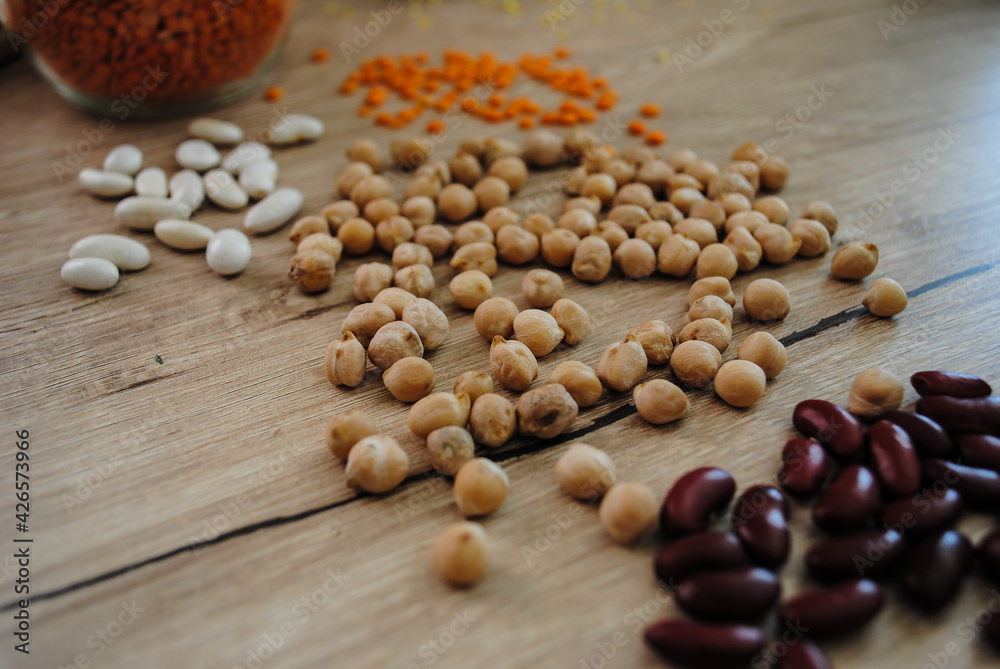 Lentils, millet, buckwheat and beans are scattered on the table. Lentils, millet, buckwheat and beans are scattered on the table.