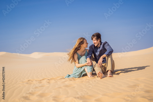 Happy couple healthy lifestyle affectionate outdoors in nature during hiking travel. Man and woman hikers smiling in mountain desert landscape. Tourism opens after quarantine COVID 19